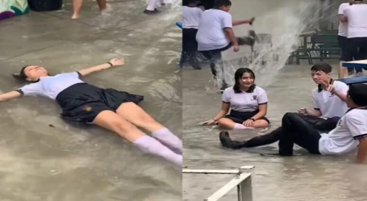 Estudiantes nadan en las inundaciones de su escuela