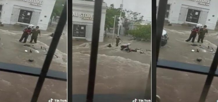 Rescatan a motociclista de ser arrastrado por las lluvias